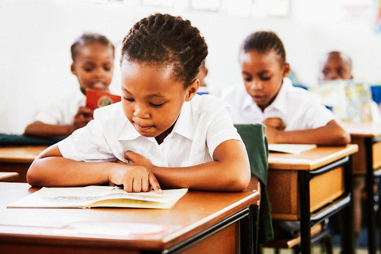 A schoolgirl working at her desk.